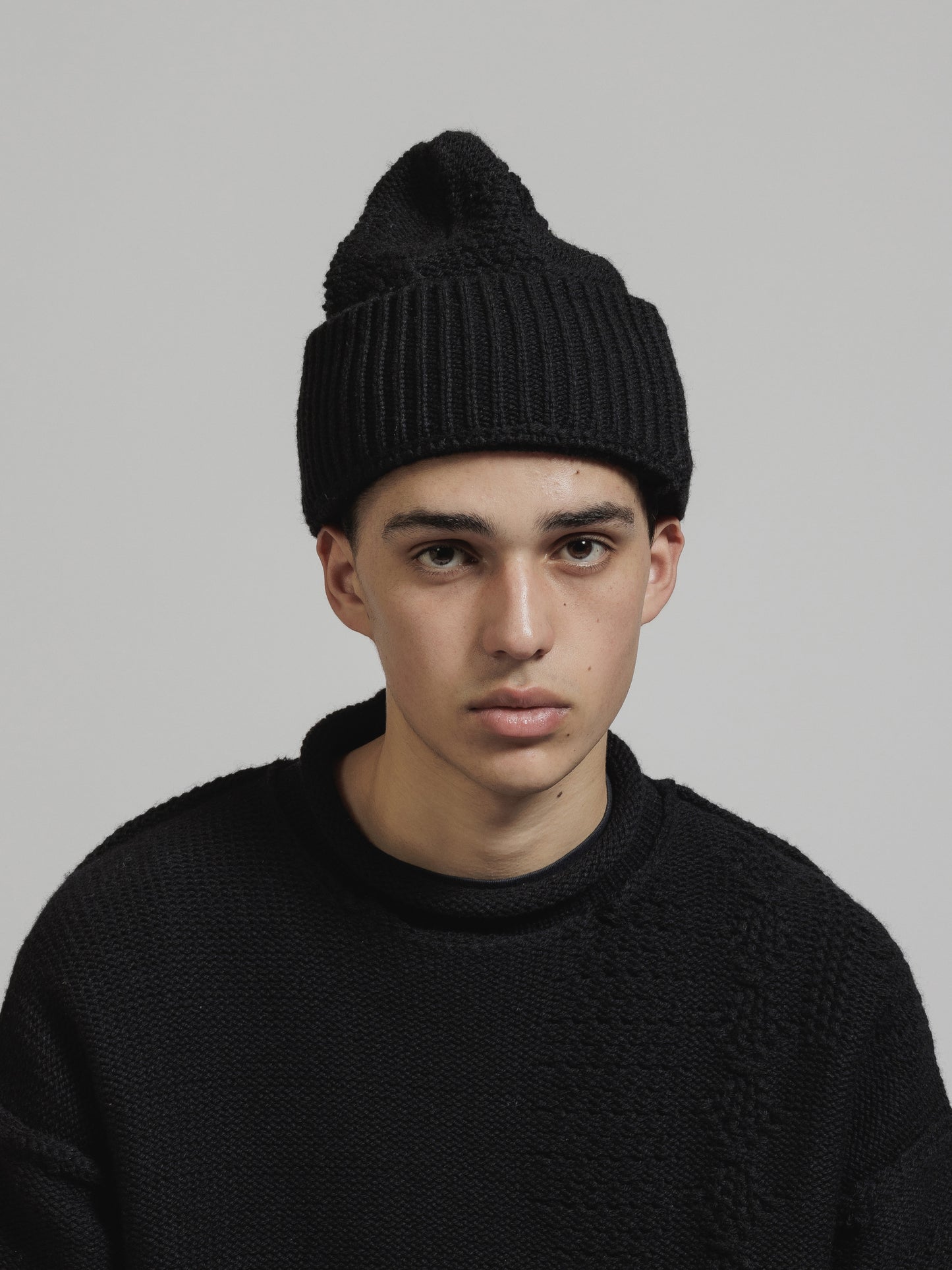 
                  
                    CABLE KNIT BEANIE
                  
                