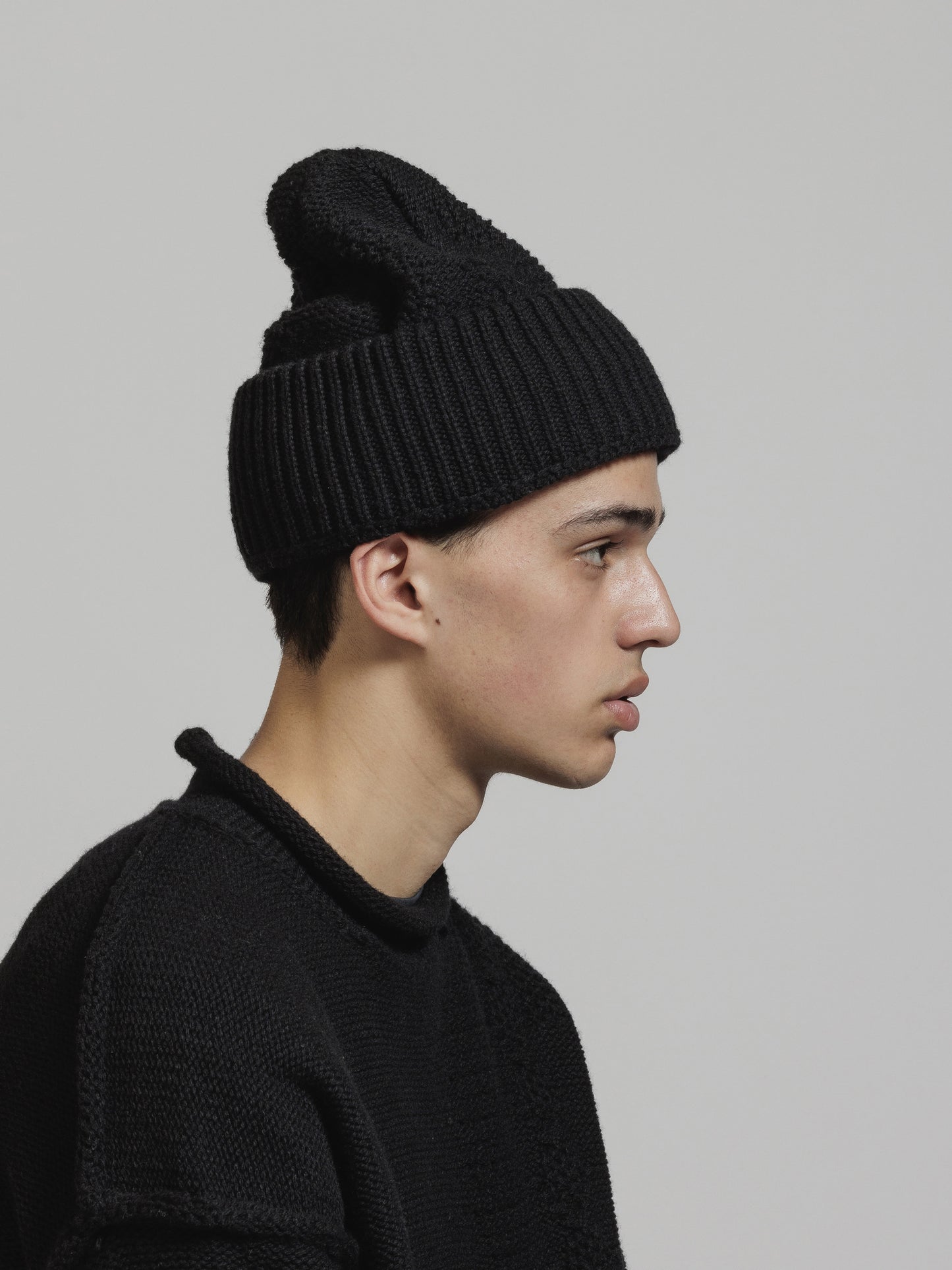 
                  
                    CABLE KNIT BEANIE
                  
                